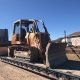 Heavy machinery on a flatbed trailer - equipment hauling