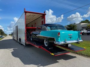 Transporting a 1955 Chevy Bel Air car in a enclosed car hauler.